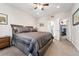 Cozy main bedroom featuring natural light, neutral colors, and an en-suite bathroom with a walk-in closet at 2622 W 24Th Ave # 2, Denver, CO 80211