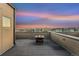 Rooftop deck with built in gas fire pit, wooden floors and a view of the surrounding city at 2622 W 24Th Ave # 2, Denver, CO 80211