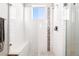 Modern shower with white subway tile, a built-in bench, and decorative tile accents at 2622 W 24Th Ave # 2, Denver, CO 80211