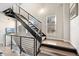 Modern staircase featuring wood stairs, metal railings, and an abundance of natural light at 2622 W 24Th Ave # 2, Denver, CO 80211