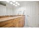 Bathroom features vanity and a white door at 36412 Paradise Cir, Elizabeth, CO 80107