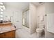 Clean bathroom featuring vanity, walk-in shower, and white tile at 36412 Paradise Cir, Elizabeth, CO 80107