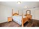 Bedroom with four-poster bed and hardwood flooring at 36412 Paradise Cir, Elizabeth, CO 80107