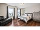 Bright bedroom features hardwood floors, natural light, and modern decor at 36412 Paradise Cir, Elizabeth, CO 80107