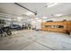 Spacious garage with ample storage space, work area, and room for multiple vehicles and equipment at 36412 Paradise Cir, Elizabeth, CO 80107