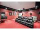 Home theater room with a projector, comfy chairs, and mounted surround sound speakers at 36412 Paradise Cir, Elizabeth, CO 80107