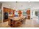 Gourmet kitchen with custom wood cabinets, granite countertops, stainless steel appliances, and center island with seating at 36412 Paradise Cir, Elizabeth, CO 80107