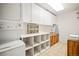 Well-organized laundry room with modern washer/dryer, ample storage, and functional counter space at 36412 Paradise Cir, Elizabeth, CO 80107