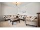 Comfortable living room featuring plush seating, ornate coffee table, and stylish decor at 36412 Paradise Cir, Elizabeth, CO 80107
