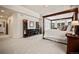 Large main bedroom featuring a four poster bed, display shelves, and ample natural light at 36412 Paradise Cir, Elizabeth, CO 80107