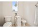 Cozy powder room featuring a toilet and bidet at 36412 Paradise Cir, Elizabeth, CO 80107