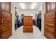 Large walk-in closet with custom wood shelving and drawers, perfect for organizing your wardrobe at 36412 Paradise Cir, Elizabeth, CO 80107