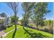 Landscaped backyard with pathway and water views at 4333 S Andes Way # 204, Aurora, CO 80015