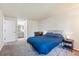 Cozy bedroom with a blue comforter and nightstand at 4333 S Andes Way # 204, Aurora, CO 80015