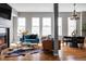 Bright living room with a fireplace, and two sofas that provide a comfy spot to relax and entertain at 1489 Steele St # 104, Denver, CO 80206