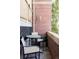 Cozy outdoor patio with seating, a brick wall, and nice views at 1489 Steele St # 104, Denver, CO 80206