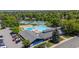 Aerial view showcasing community pool, tennis courts, and clubhouse amenities at 5755 S Fulton Way, Greenwood Village, CO 80111