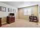 Comfortable bedroom features neutral walls, plush carpeting, and plantation shutters for bright natural light at 5755 S Fulton Way, Greenwood Village, CO 80111