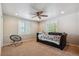 Bright bedroom with a ceiling fan, great natural light and a cozy lounge sofa at 5755 S Fulton Way, Greenwood Village, CO 80111