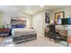This bedroom features a unique wood accent bed frame, modern décor, and soft lighting for a relaxing space at 5755 S Fulton Way, Greenwood Village, CO 80111