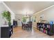Cozy dining room area with hardwood floors, natural light, and decorative chandelier at 5755 S Fulton Way, Greenwood Village, CO 80111