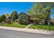Charming two-story home with lush lawn, mature trees, and professional landscaping at 5755 S Fulton Way, Greenwood Village, CO 80111