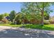 Charming two-story home with landscaped yard and mature shade trees on a sunny day at 5755 S Fulton Way, Greenwood Village, CO 80111