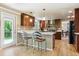 Stylish kitchen with modern appliances, breakfast bar, and a view to the outdoors at 5755 S Fulton Way, Greenwood Village, CO 80111