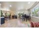 Spacious living room with hardwood floors, piano, and dining area at 5755 S Fulton Way, Greenwood Village, CO 80111