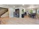 Open concept with hardwood floors, staircase and dining area at 5755 S Fulton Way, Greenwood Village, CO 80111