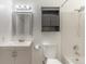 This bathroom features a tub-shower combo, updated vanity, and medicine cabinet at 13393 E Louisiana Ave, Aurora, CO 80012