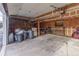 A spacious garage interior is shown with potential for parking and storage at 13393 E Louisiana Ave, Aurora, CO 80012