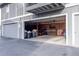 Open garage with storage and bike, showing its potential uses at 13393 E Louisiana Ave, Aurora, CO 80012