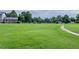 Expansive community green space featuring open green space, walking trail, and community housing at 13393 E Louisiana Ave, Aurora, CO 80012