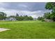 Expansive community green space featuring open green space, lush green lawn and community housing at 13393 E Louisiana Ave, Aurora, CO 80012