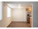 A cozy dining nook with natural light, wood cabinets and stainless steel refrigerator at 13393 E Louisiana Ave, Aurora, CO 80012