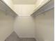 A walk-in closet with carpet and clothes rails at 13393 E Louisiana Ave, Aurora, CO 80012