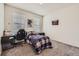 Bedroom with plush carpet, a single bed, a desk, and two windows at 935 Peach Leaf Ln, Elizabeth, CO 80107