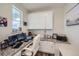 Bright home office with granite counters, white cabinets, and large windows providing plenty of natural light at 935 Peach Leaf Ln, Elizabeth, CO 80107