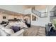 Bright and airy living room featuring an open floor plan, soaring ceilings, and a modern staircase at 935 Peach Leaf Ln, Elizabeth, CO 80107