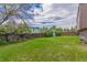 Well-sized backyard with green lawn and wooden fence, provides privacy at 11599 Kendall St, Westminster, CO 80020