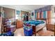This bedroom offers hardwood floors, ample storage with built-in closets, and a relaxing spot at 11599 Kendall St, Westminster, CO 80020