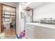 Bright laundry room with modern washer and dryer hookups and plenty of storage at 11599 Kendall St, Westminster, CO 80020