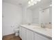 Bright bathroom featuring a double vanity with quartz countertop and modern fixtures at 1331 Rock Cliff Ave, Erie, CO 80516