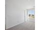 Bedroom features carpet flooring, a window with neighborhood views, and a closet for storage at 1331 Rock Cliff Ave, Erie, CO 80516