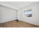 Bright entryway with wood floors, white walls, large window and a modern front door at 1331 Rock Cliff Ave, Erie, CO 80516