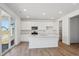 Stylish kitchen features an island, stainless appliances, and plenty of countertop space at 1331 Rock Cliff Ave, Erie, CO 80516