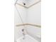Clean white shower and bathtub with stylish accent tiles and chrome fixtures at 1143 S Saint Paul St, Denver, CO 80210