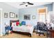 Bright bedroom with comfortable bed, study desk, and wall decor at 1143 S Saint Paul St, Denver, CO 80210