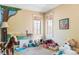 Bright bedroom with custom mural, plenty of natural light, and a playful atmosphere at 1143 S Saint Paul St, Denver, CO 80210